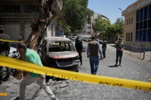 Syria says one killed, 36 wounded after Damascus blasts during Macron visit