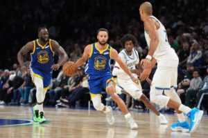 Stephen Curry, Warriors hold nerve to beat Timberwolves in tight NBA battle